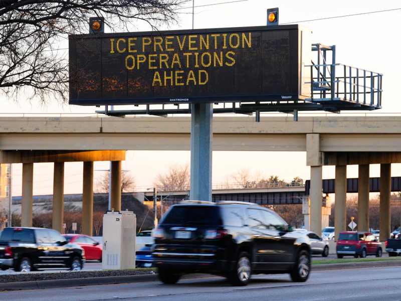 An electronic billboard on a highway that says, “Ice Prevention Operations Ahead.”
