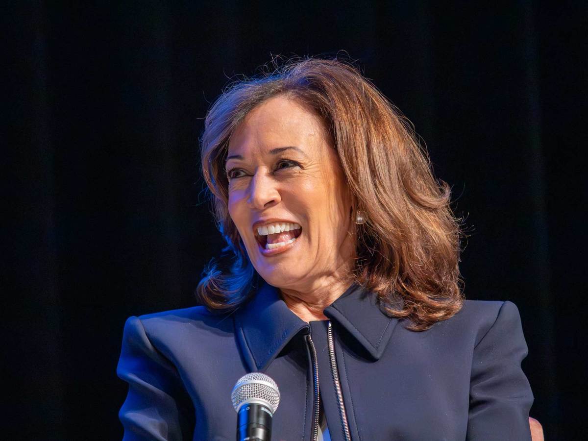 A closeup of Kamala Harris smiling on stage