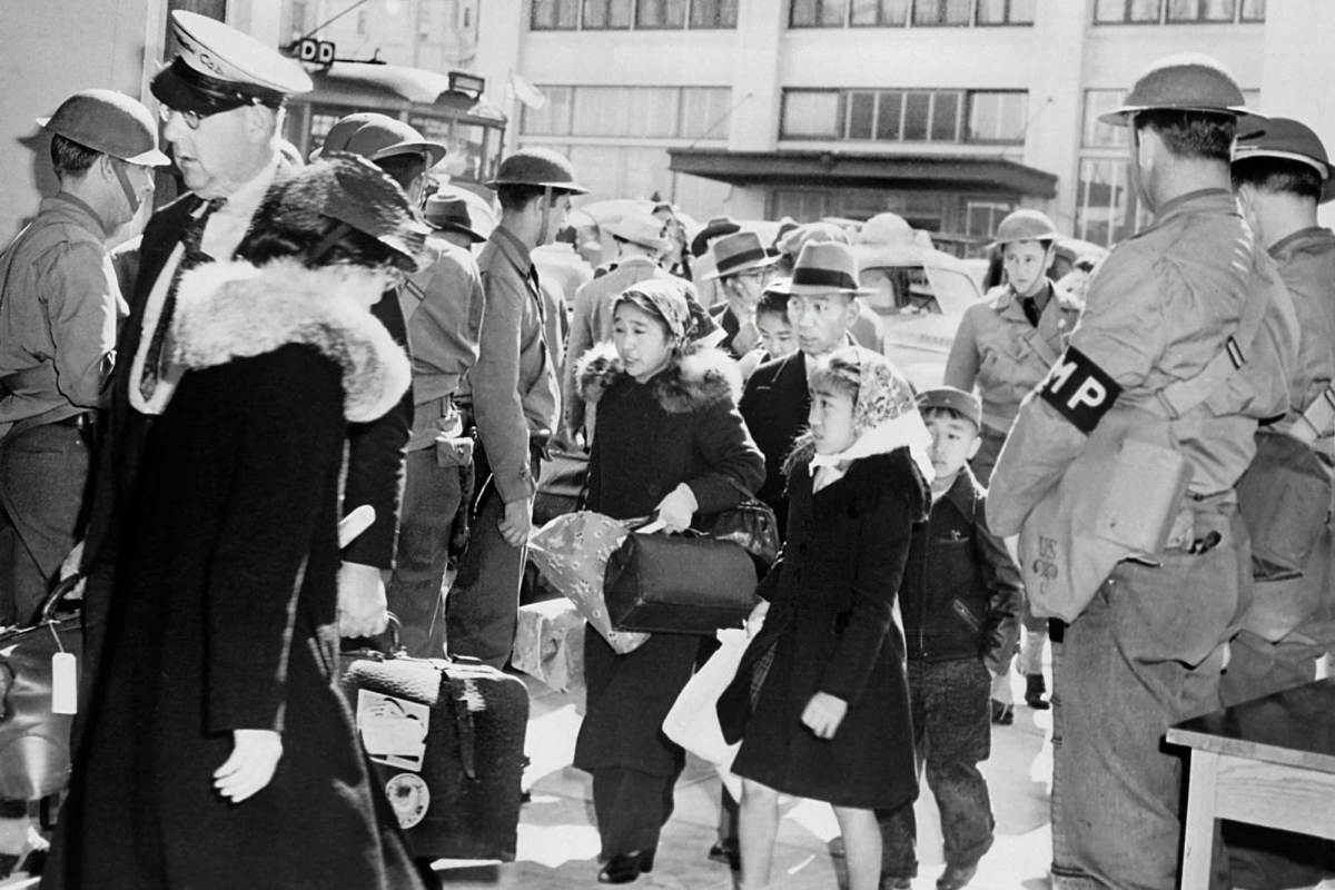 A Japanese American family is taken to a relocation center in San Francisco in May 1942. Photo by Circa Images/GHI/Universal History Archive/Universal Images Group via Getty Images