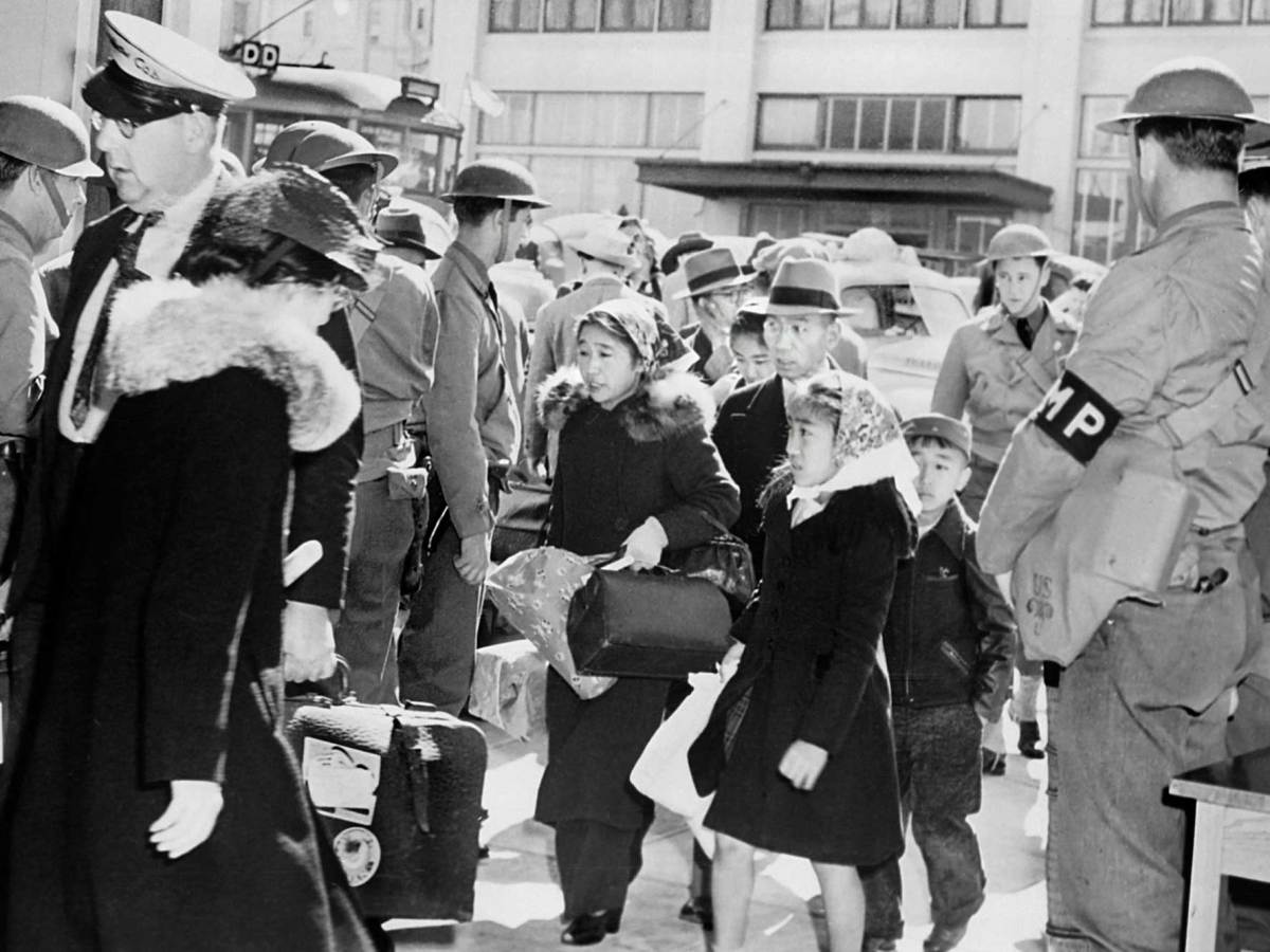 A Japanese American family is taken to a relocation center in San Francisco in May 1942. Photo by Circa Images/GHI/Universal History Archive/Universal Images Group via Getty Images