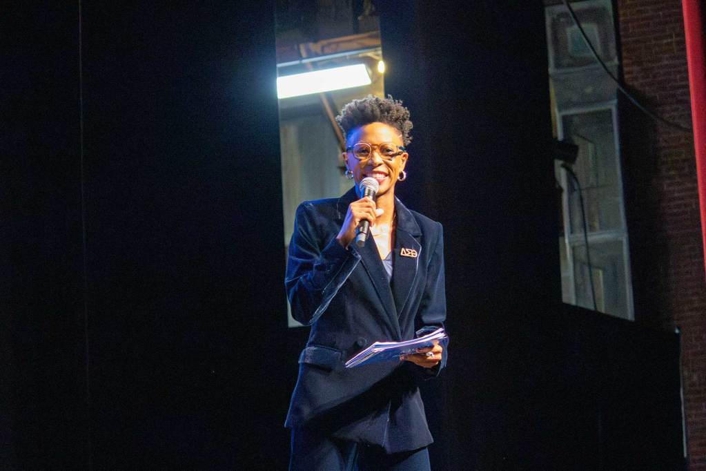 Rita Brent speaking on stage
