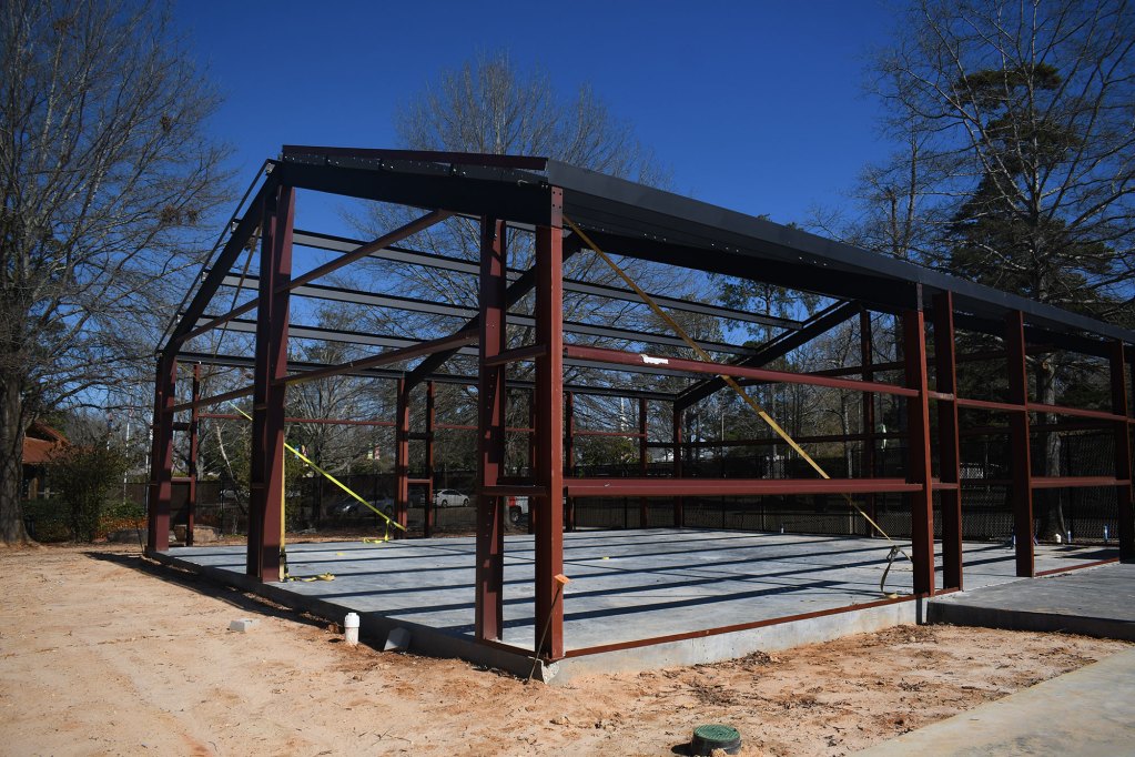 Steel framing rises from a concrete slab at a new building under construction at the Hattiesburg Zoo.