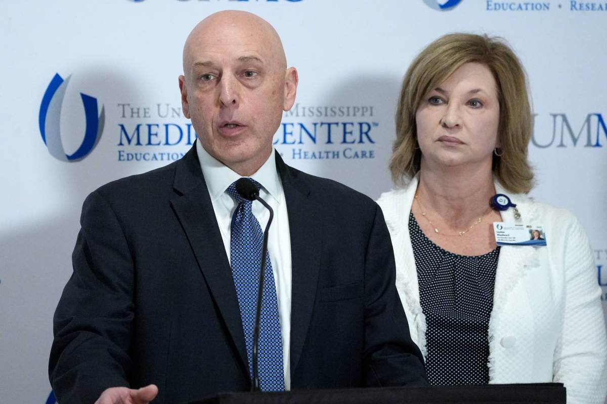 An FBI agent speaks at a press conference at UMMC