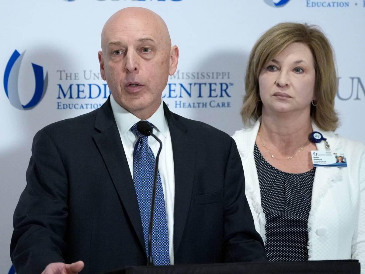 An FBI agent speaks at a press conference at UMMC
