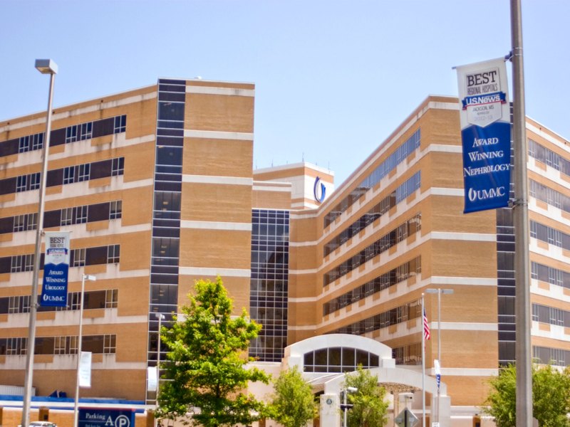 An exterior view of the UMMC hospital campus with multistory brown and white brick buildings