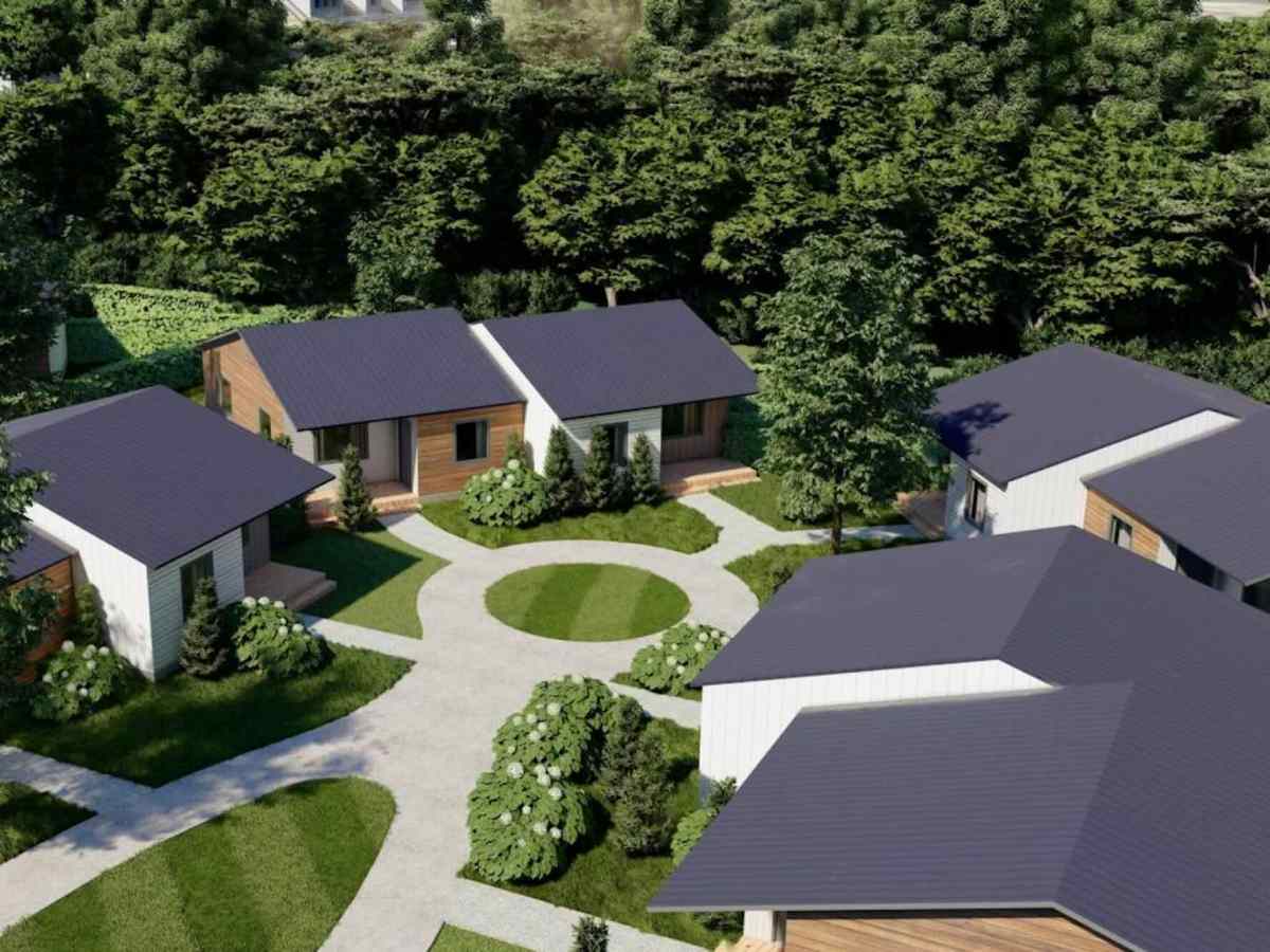 An aerial rendering of small homes in a neighborhood with a circular sidewalk in the middle.