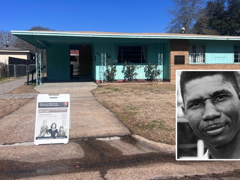 a small green and brick home has a sign in the driveway that says “Medgar and Myrlie Evers National Monument - open Tuesday through Saturday 9 am to 4 pm”
