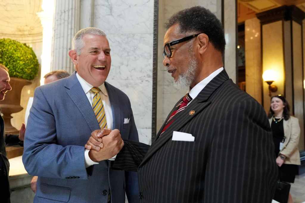 Philip Gunn shakes hands with Sollie Norwood