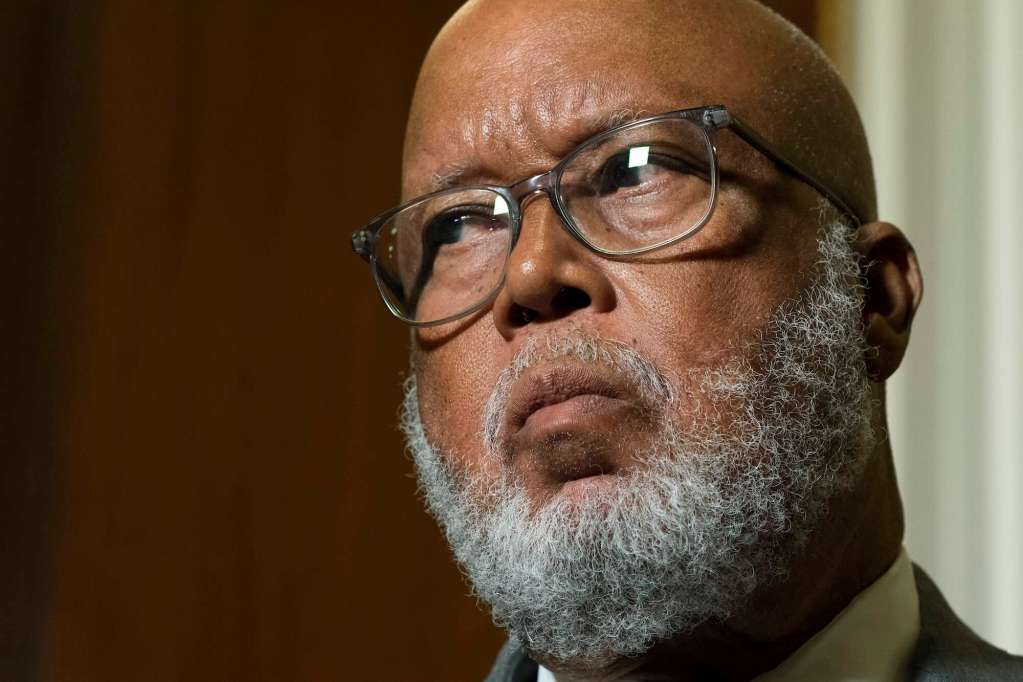 A close up of Bennie Thompson inside a room, listening to something