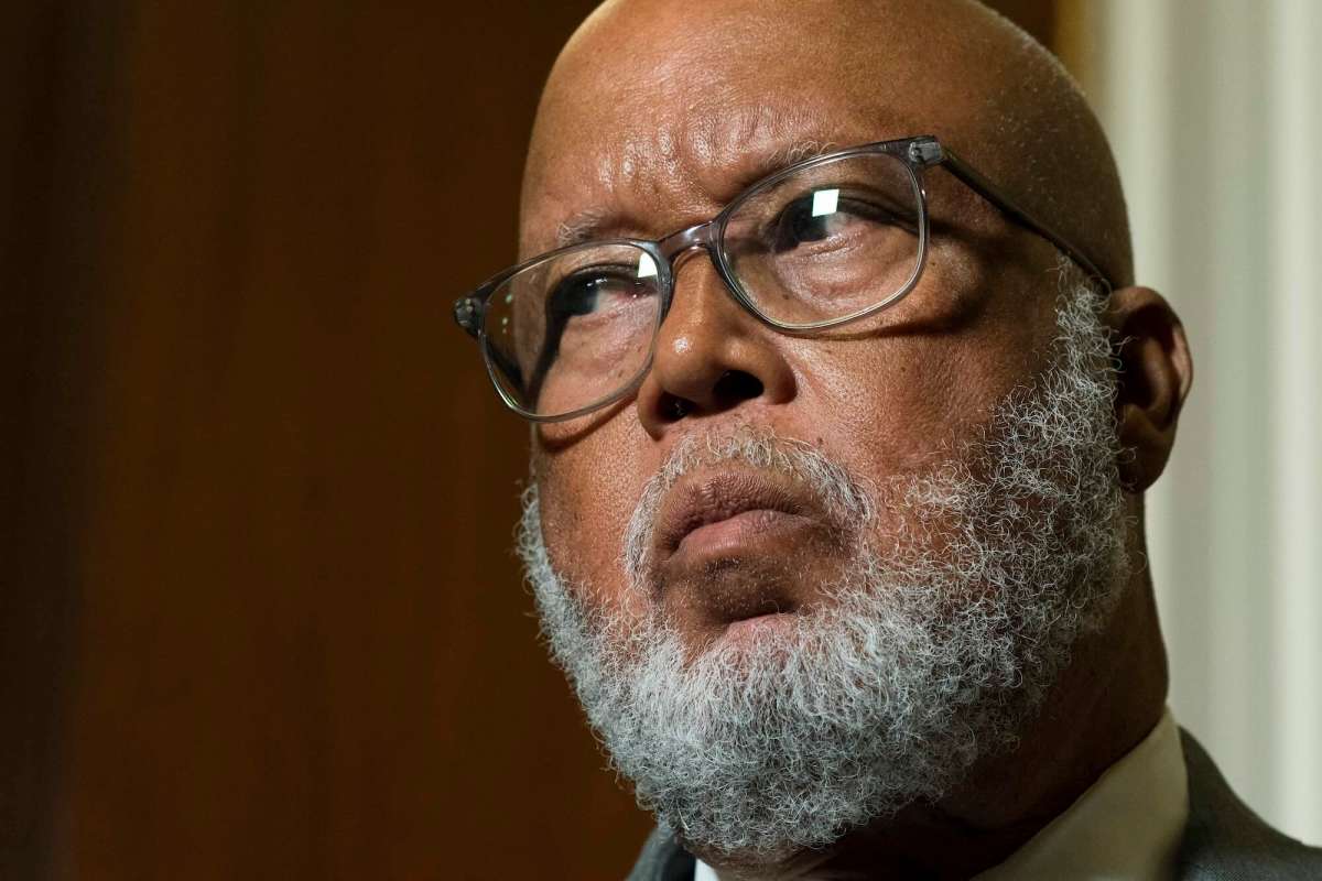 A close up of Bennie Thompson inside a room, listening to something