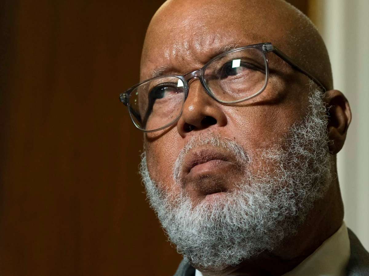 A close up of Bennie Thompson inside a room, listening to something