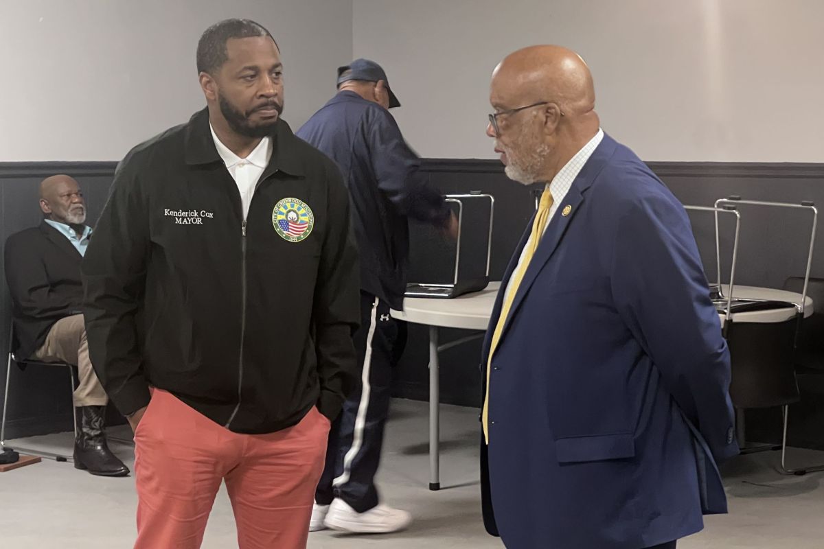 Mayor Kendrick Cox and Bennie Thompson speaking to each other at an event