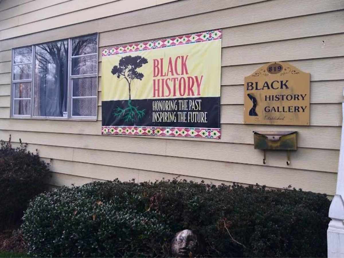 A side of a building with a sign that reads “Black History, Honoring the Past, Inspiring the Future.”