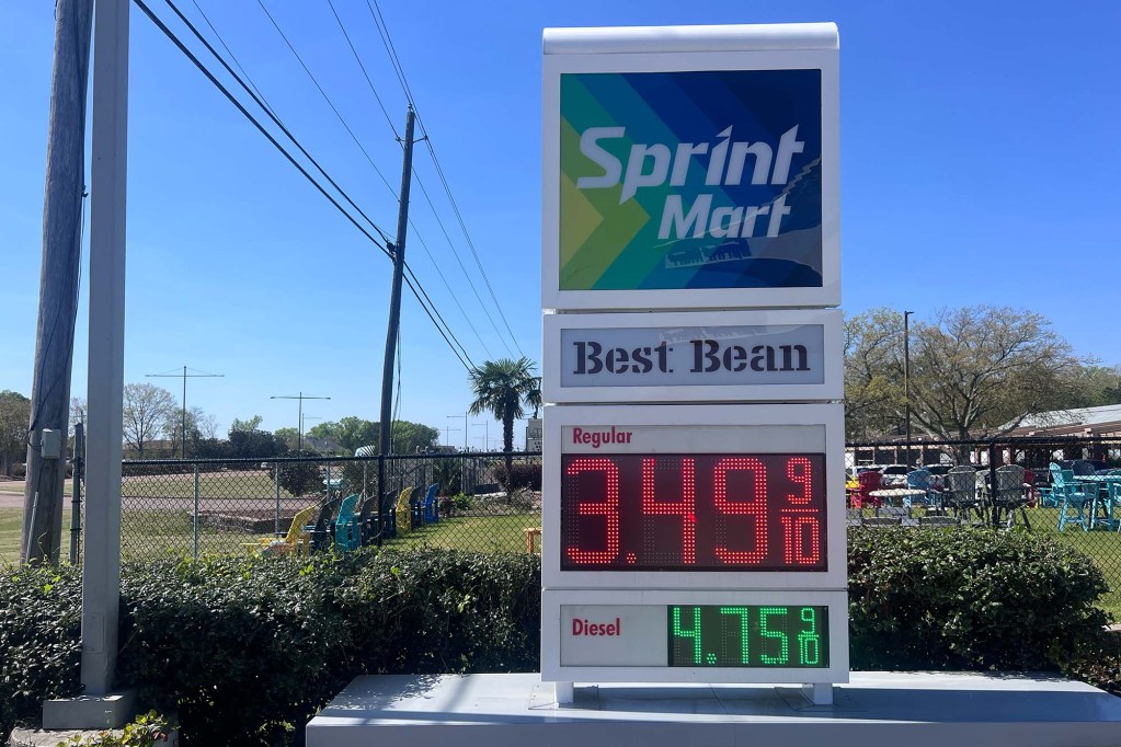 A sign for a gas station that says “Sprint Mart” advertising gas for $3.49/gallon.