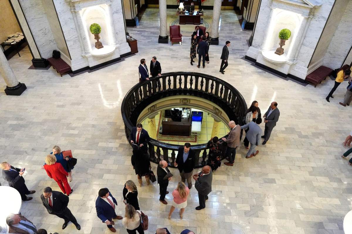 An overhead view of a rotunda walkway filled with people