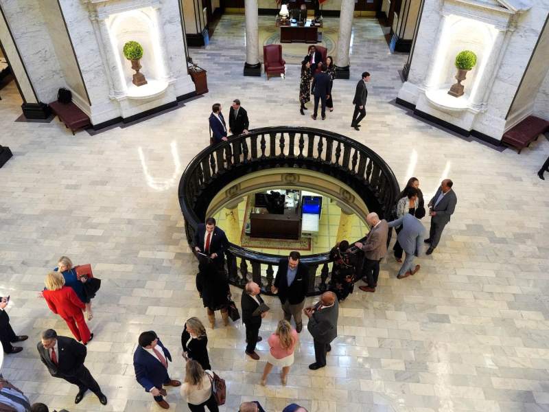 An overhead view of a rotunda walkway filled with people