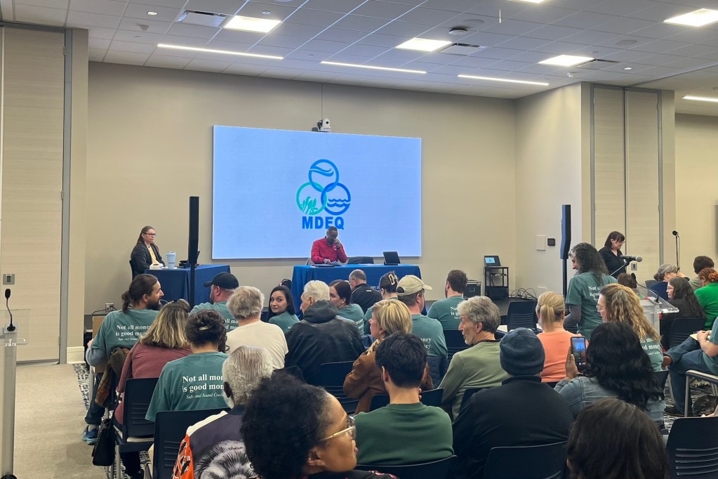 A room full of people sitting in a MDEQ meeting