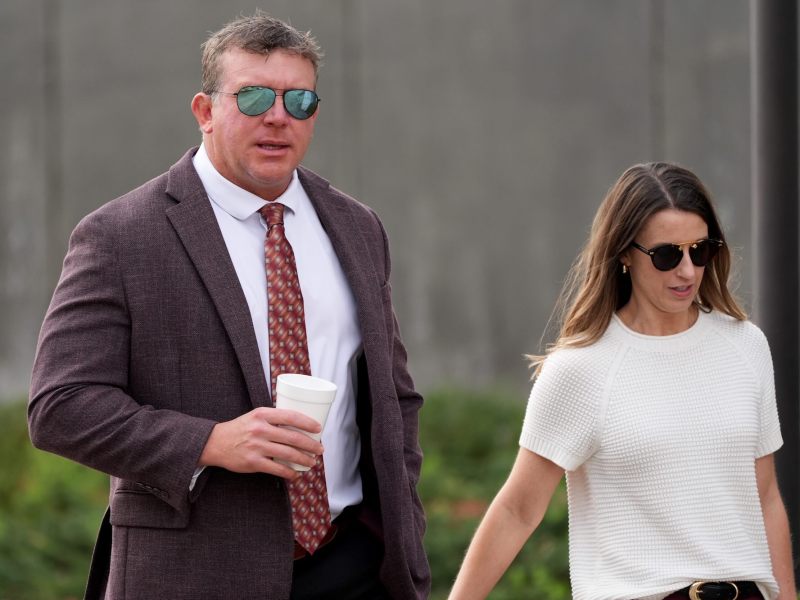 Ted DiBiase Jr. and his wife walk side by side outside