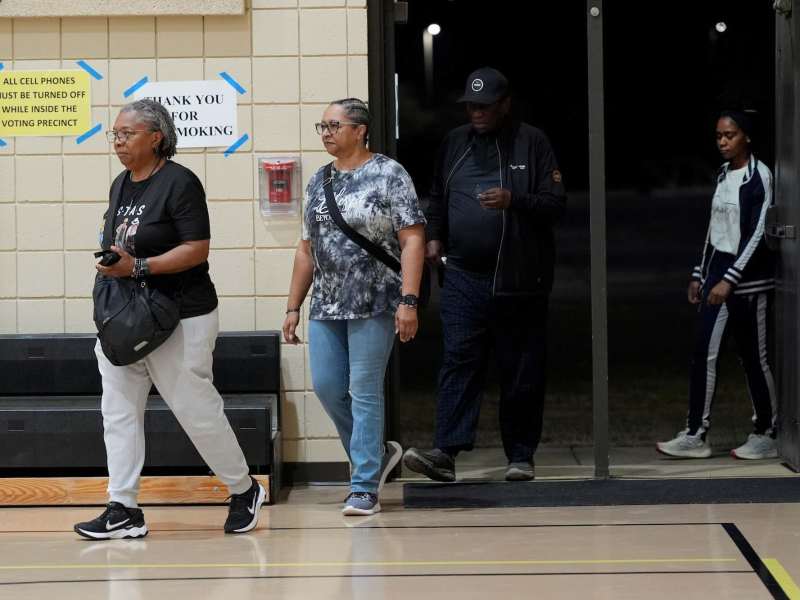 Voters seen walking out of a polling place