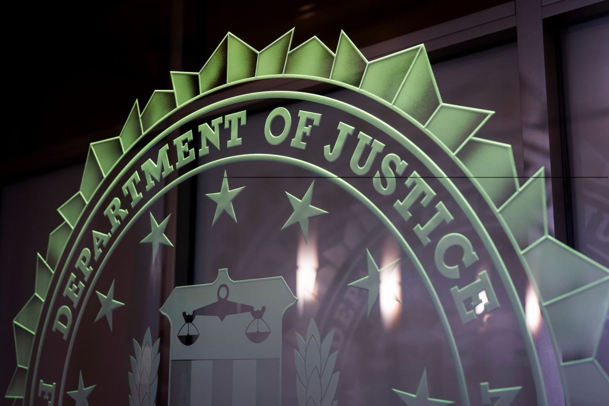 The seal for the Department of Justice etched in glass