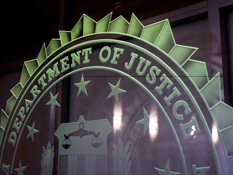 The seal for the Department of Justice etched in glass