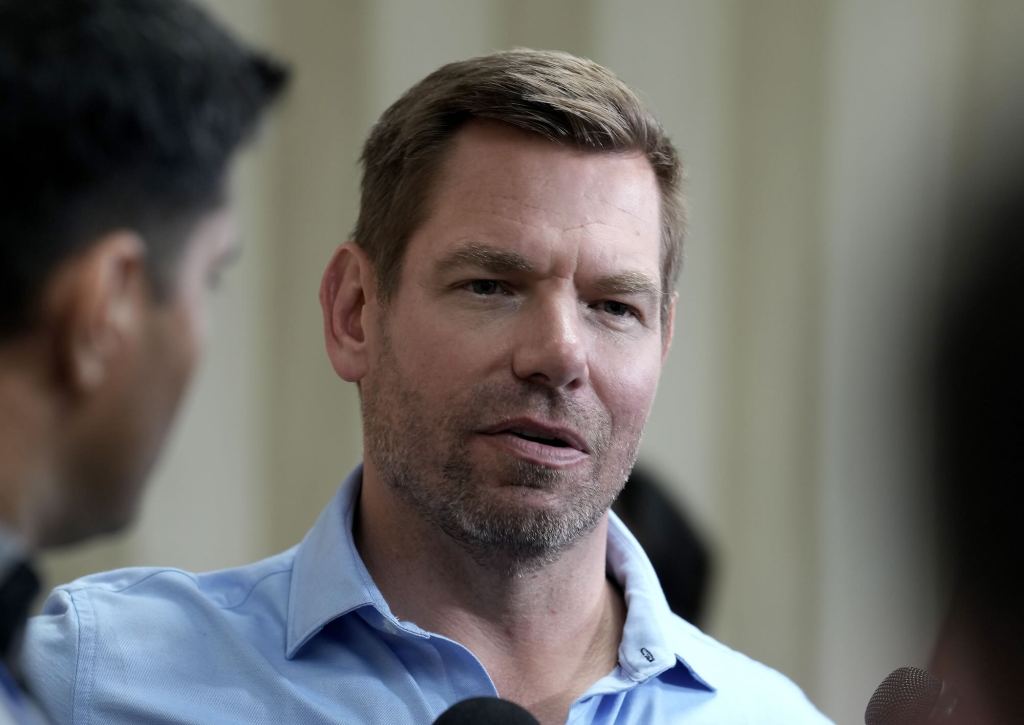 A closeup of Eric Swalwell speaking at an event