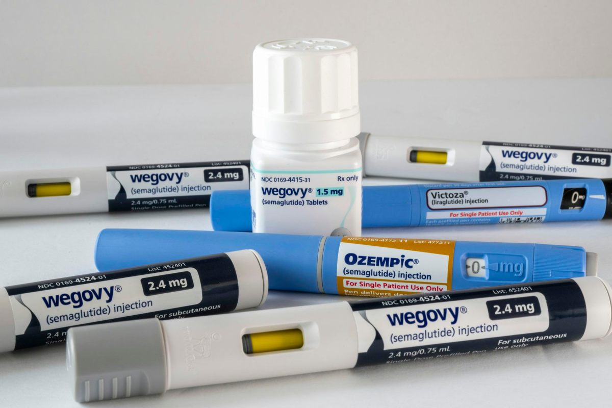 A set of Wegovy medications in injection and pill packaging