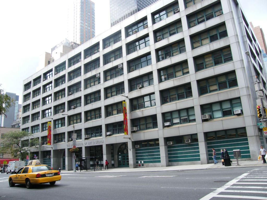 A wide seven story building in Manhattan