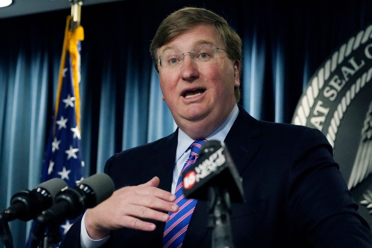 A close-up of Tate Reeves speaking at a news conference
