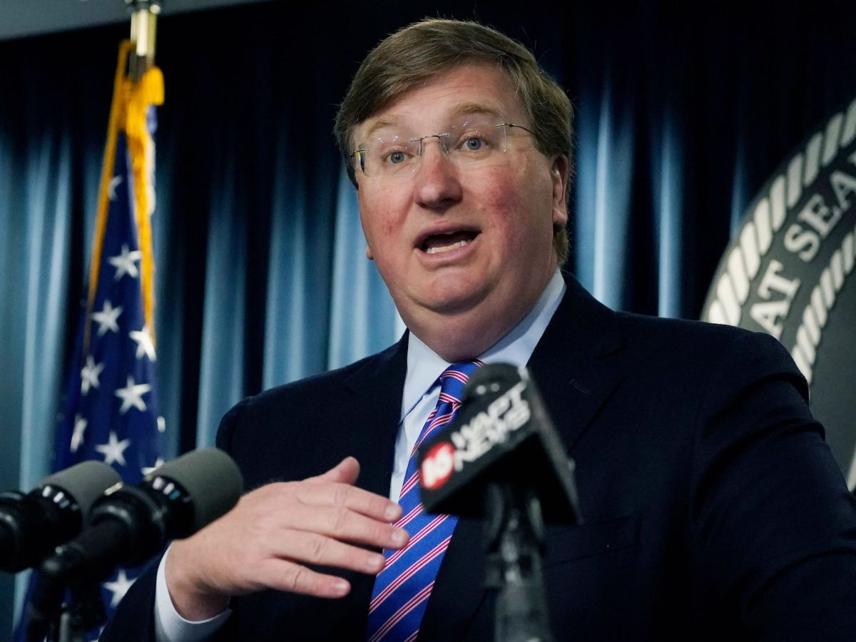 A close-up of Tate Reeves speaking at a news conference