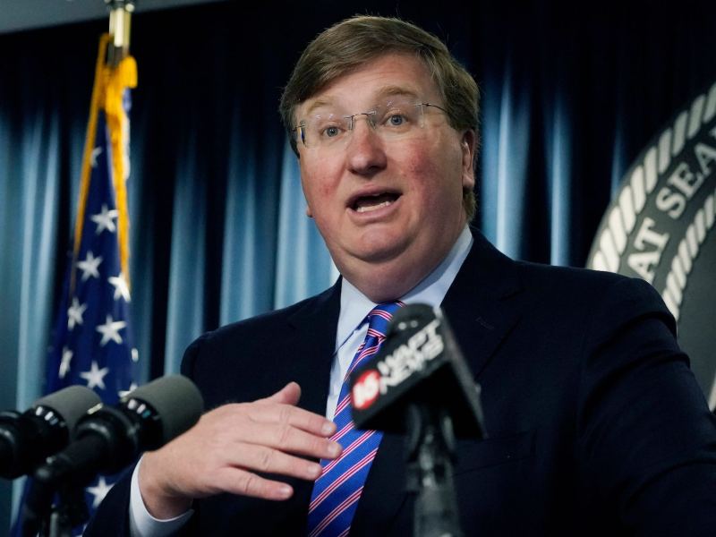 A close-up of Tate Reeves speaking at a news conference