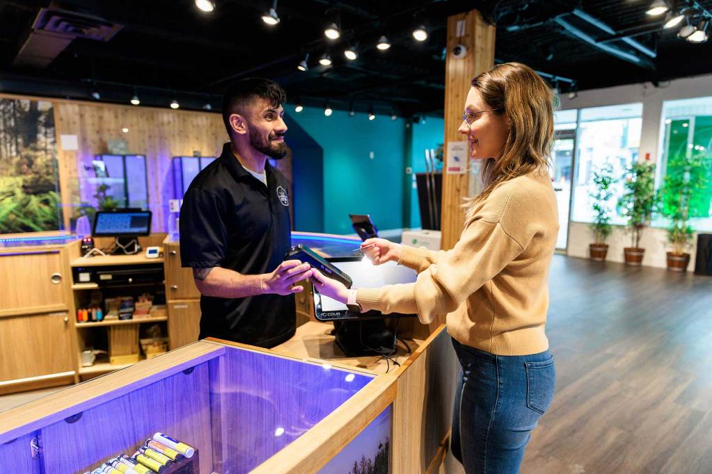 A person is buying products at a store