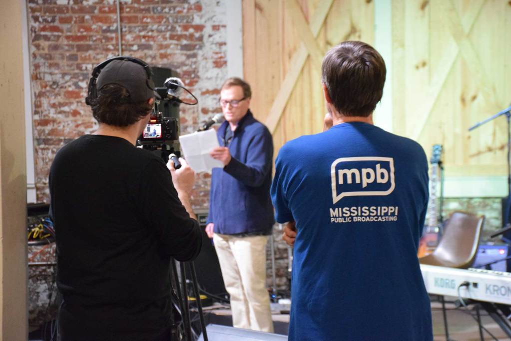 Two Mississippi Public Broadcast crew members record video of Thacker Mountain Radio.