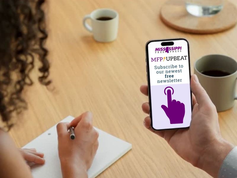 A hand shows another person a phone with a screen for MFP Upbeat