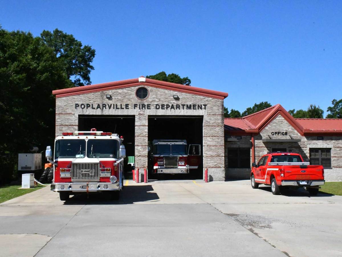 The Poplarville Fire Department building with fire trucks parked in the bays.