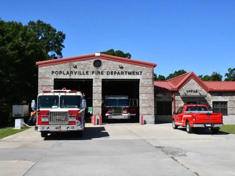 The Poplarville Fire Department building with fire trucks parked in the bays.