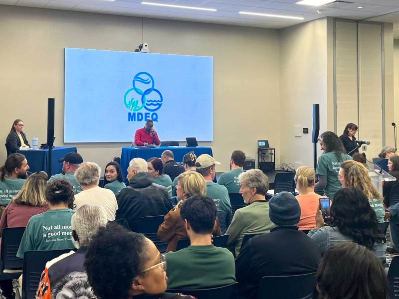 A room full of people sitting in a MDEQ meeting