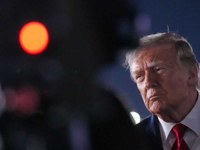 A view of Donald Trump seen past a camera