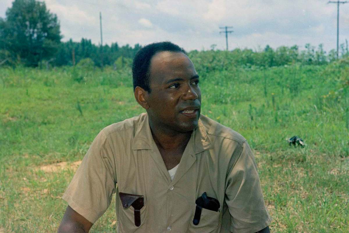 James Meredith, seen outside by a wide green field