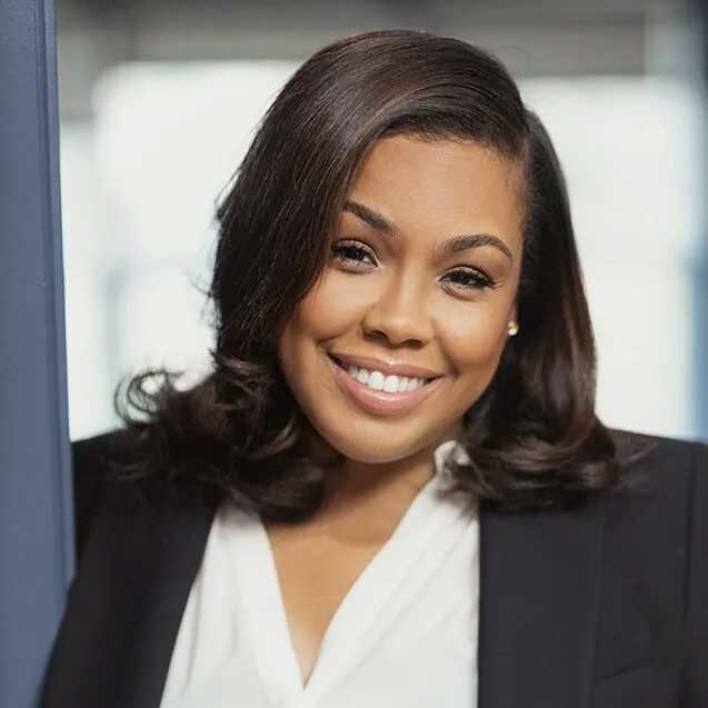 Headshot of Kathryn Young Williams wearing a black suit